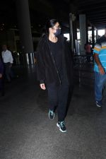 Katrina Kaif, dressed in black and wearing sunglasses and a mask, seen sporting Nike shoes